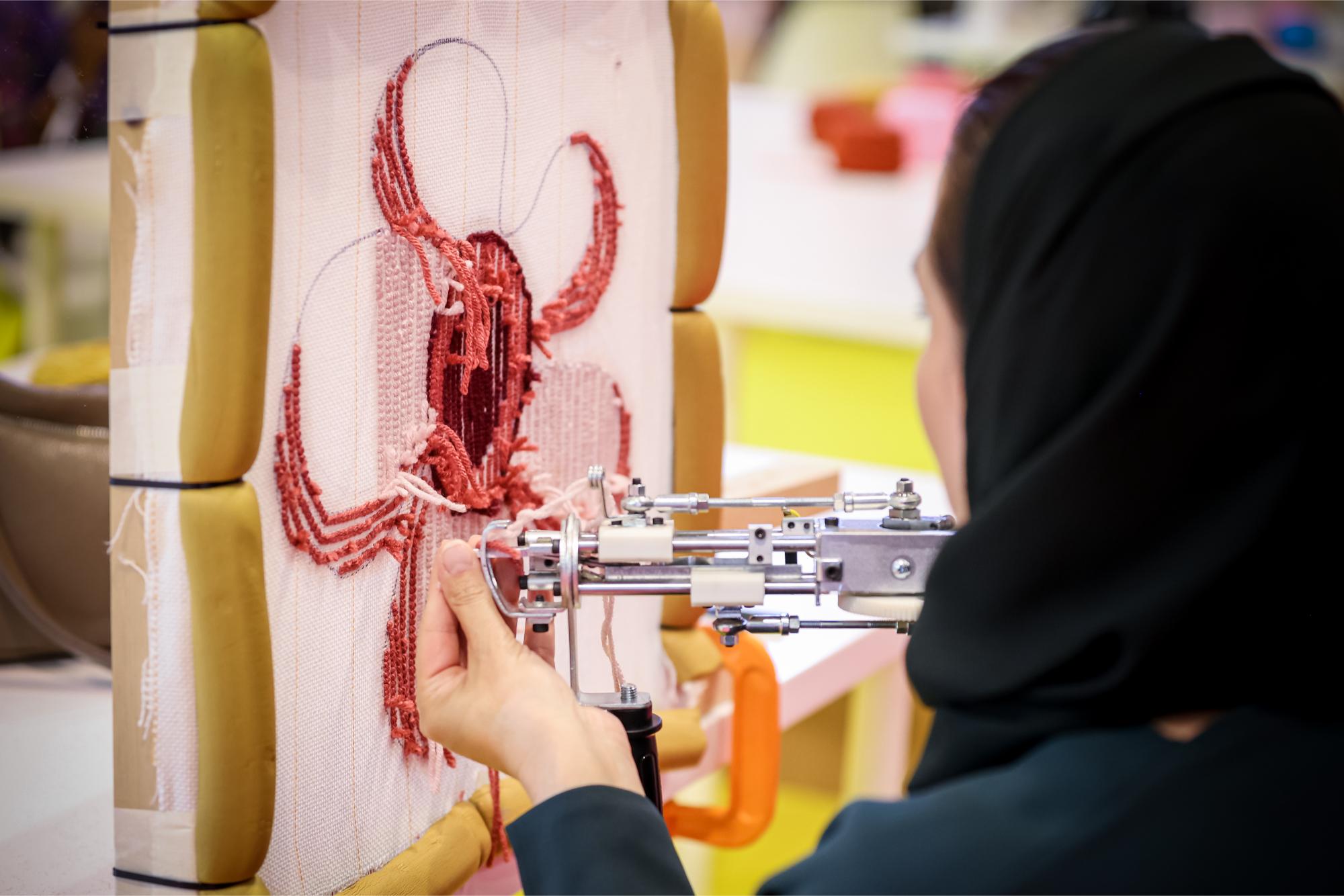 Live textile art demonstration at Textile Hub, World Art Dubai